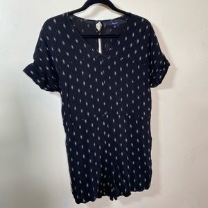 Black romper with white patterned detailing